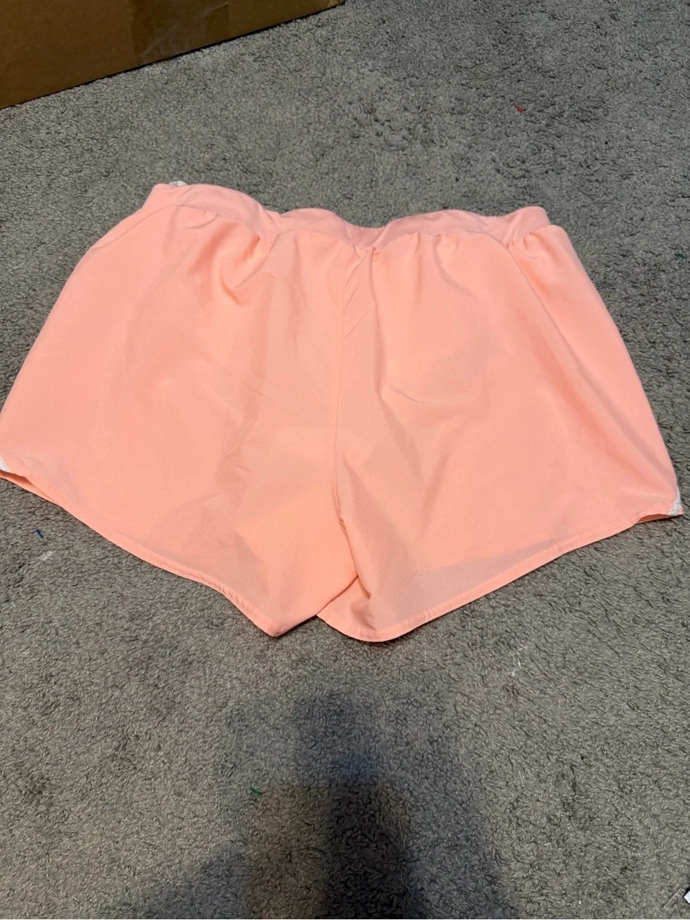Under Armour Peach Women’s Athletic Shorts with White Trim